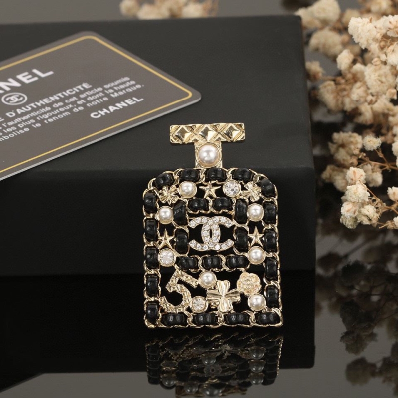 Ch*el brooches